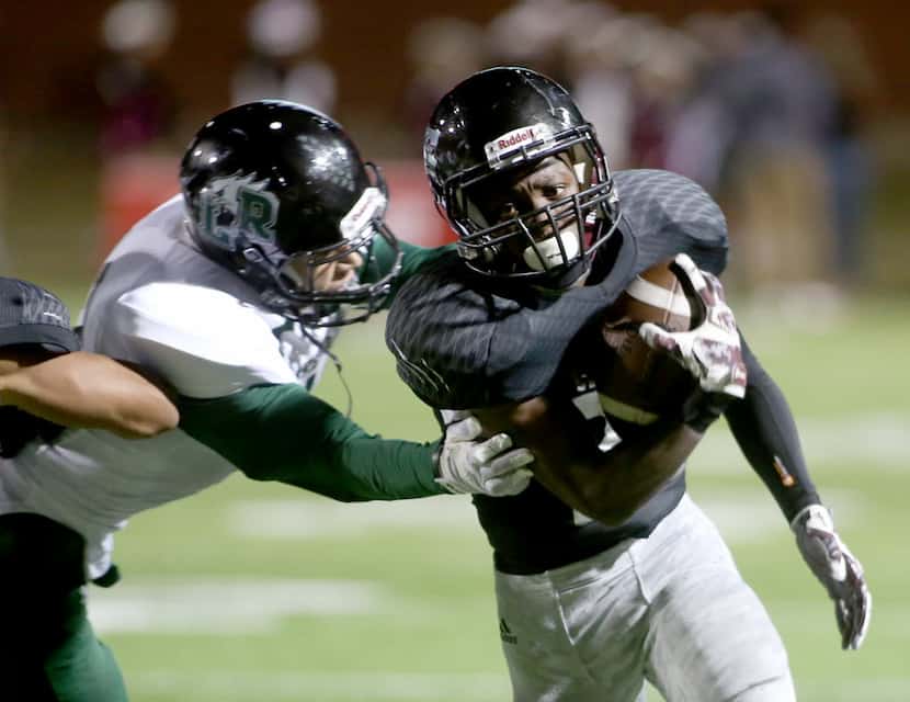 Timberview's Travonne Armstead (22), breaks a tackle, as Mansfield Lake Ridge faces...
