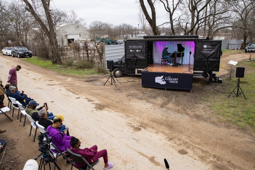 Shaun Martin performs outside of Marsha Jackson's home in Dallas on Friday, Feb. 26, 2021....