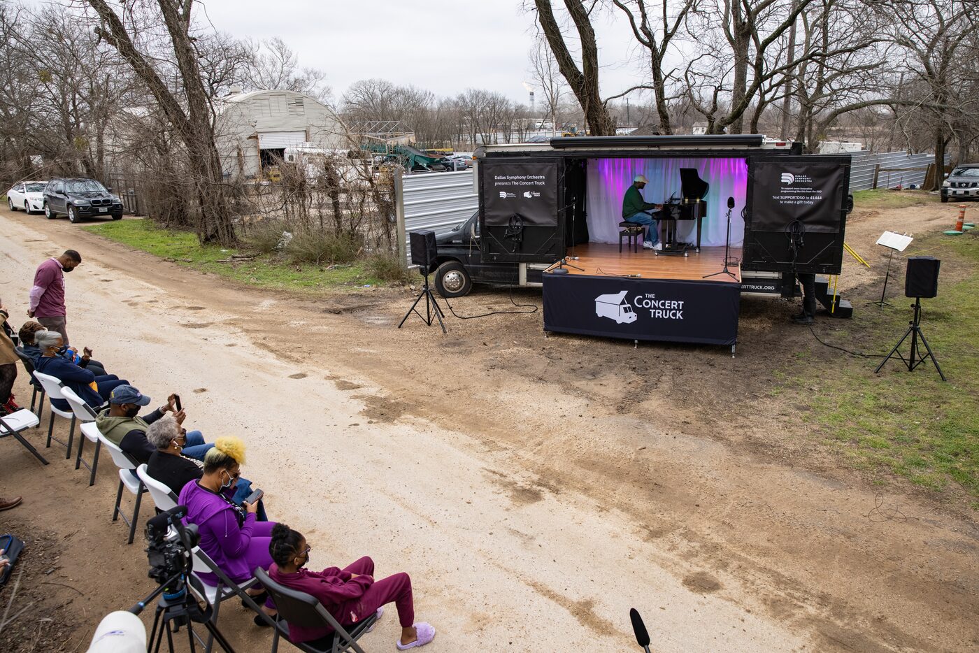 Shaun Martin performs outside of Marsha Jackson's home in Dallas on Friday, Feb. 26, 2021....