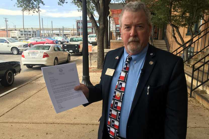 Former Garland City Council member Stephen Stanley holds a copy of a letter requesting a...