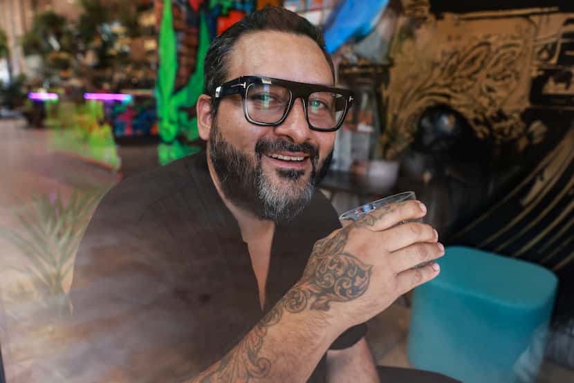 Gino Rojas sits at Revolver Taco Gastro Cantina in Deep Ellum.