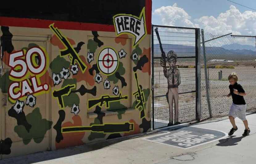 
A child runs by the Arizona gun range where instructor Charles Vacca was accidentally...
