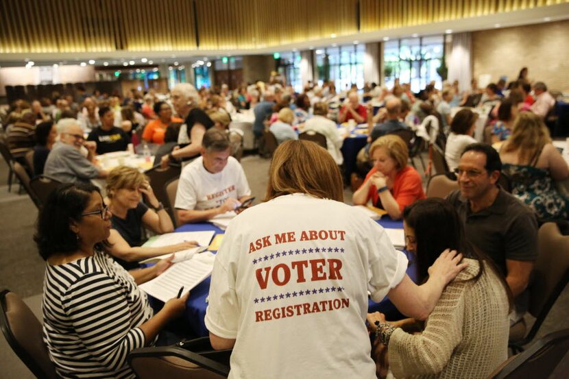 Nancy Lubar collects registration cards during a deputy voter registrar class hosted by...