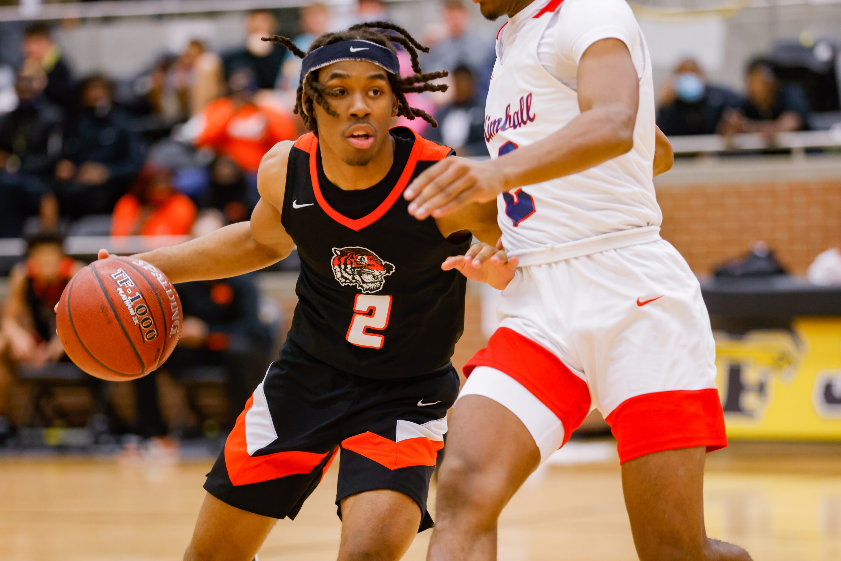 Lancaster's Dorian Goodman (2) attempts to drive past Kimball's Arterio Morris (2) during...