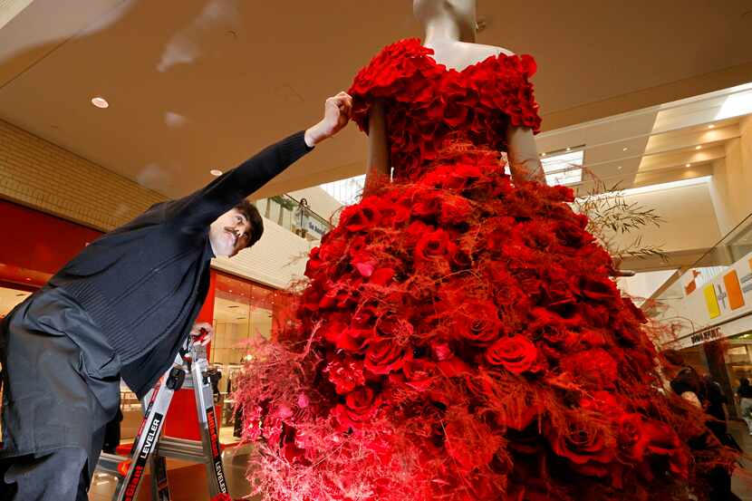 Alexander Botello of Twelve Thirty Four Studio creates a flower dress for a mannequin with...