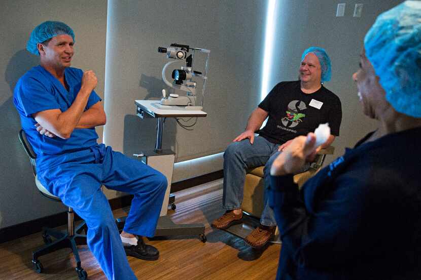 Dr. Brad Bowman (left), a surgeon at Cornea Associates of Texas, jokes with patient Ted...