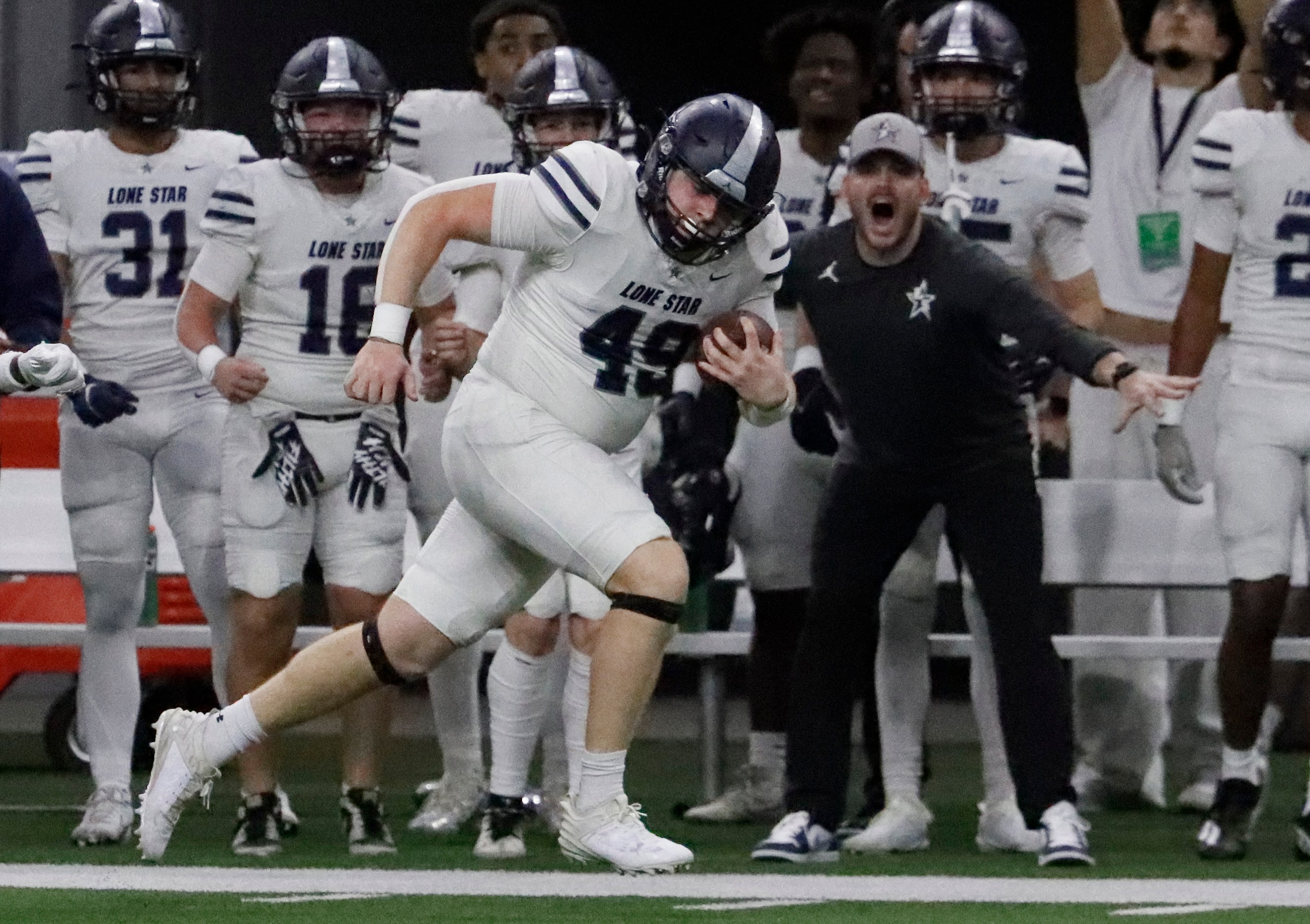 Lone Star High School tight end Colsen Jaggars (49) heads for the end zone for a long...