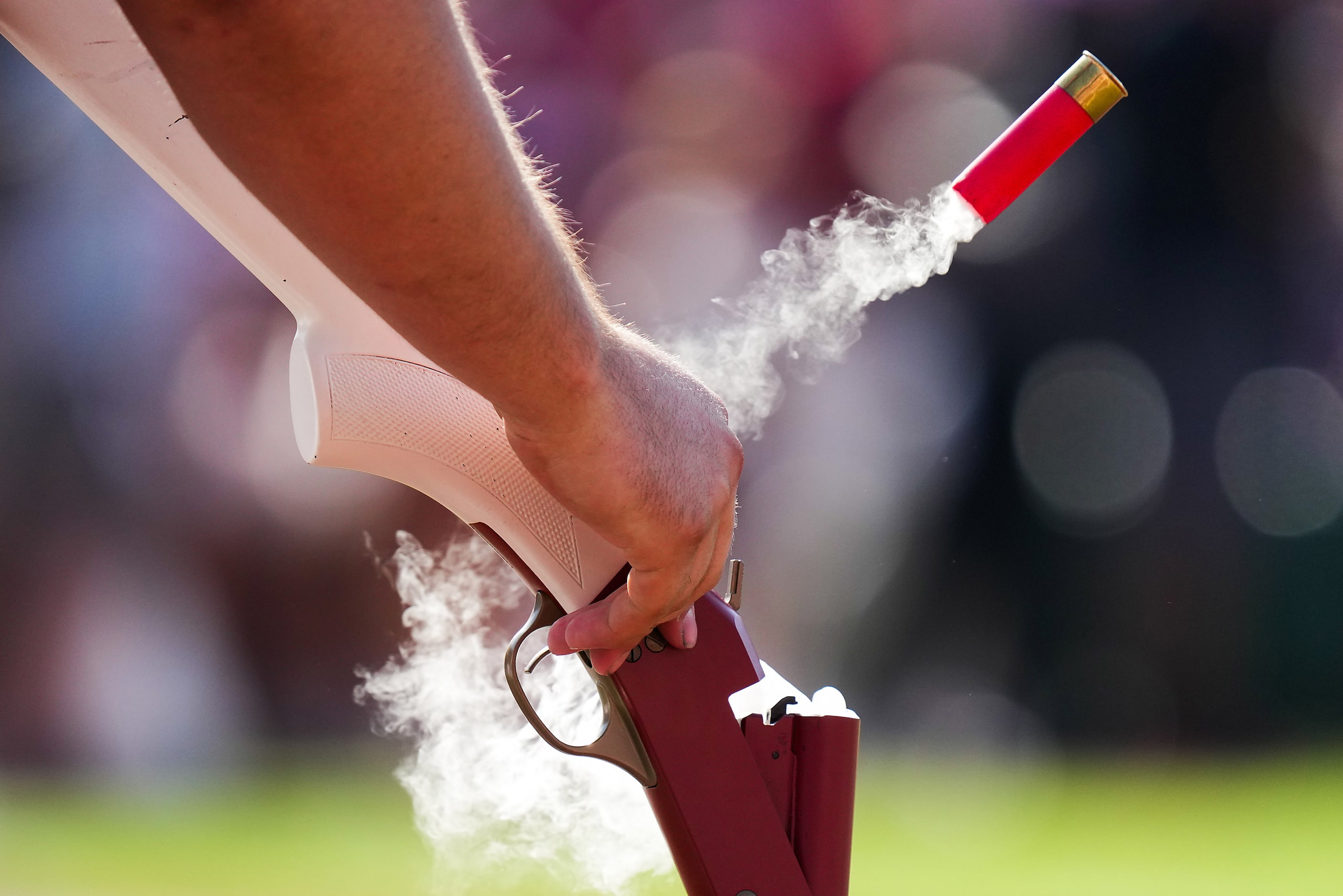 A member of the Oklahoma RUF/NEKS ejects a shell during the first half of an NCAA college...