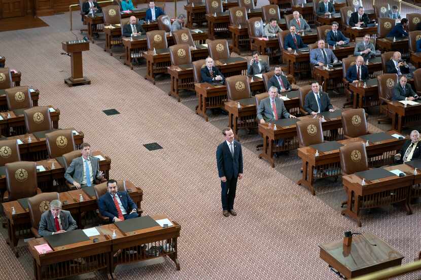 House Speaker Dade Phelan poses for a picture in the middle of the chamber as Republican...