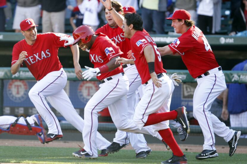 Texas Rangers shortstop Elvis Andrus (1), Texas Rangers second baseman Ian Kinsler (5) and...