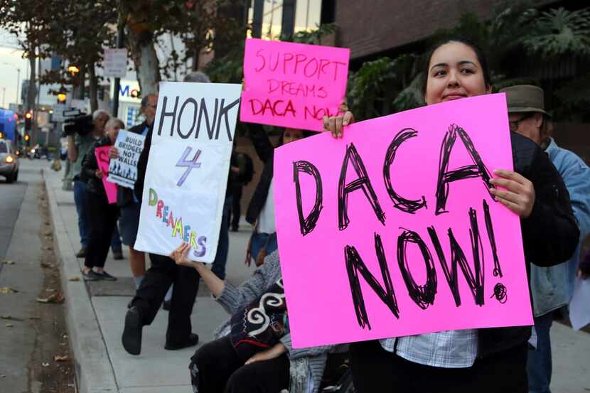 Demonstrators urging the Democratic Party to protect the Deferred Action for Childhood...