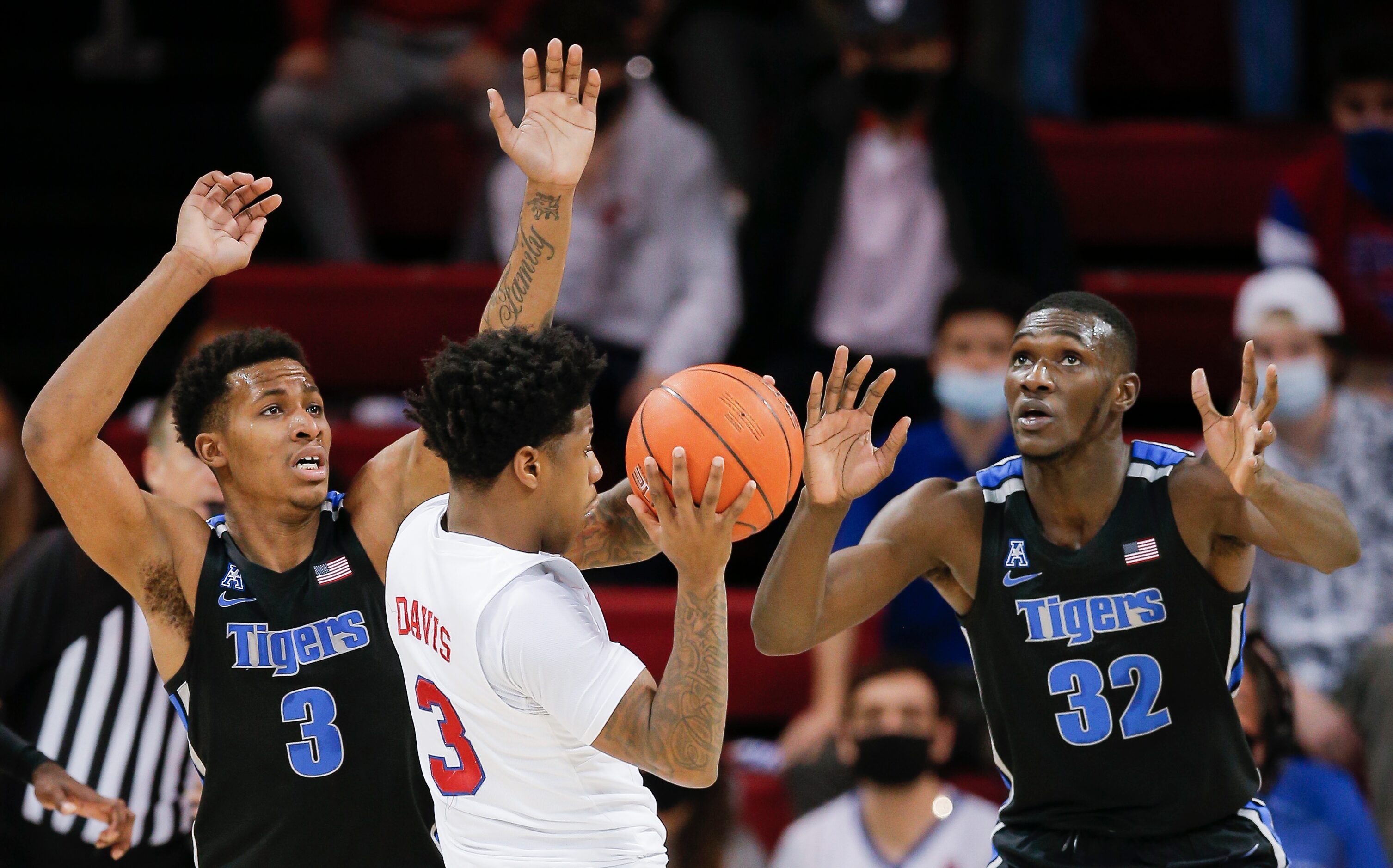 SMU guard Kendric Davis (3) looks for an open teammate as Memphis guard Landers Nolley II...