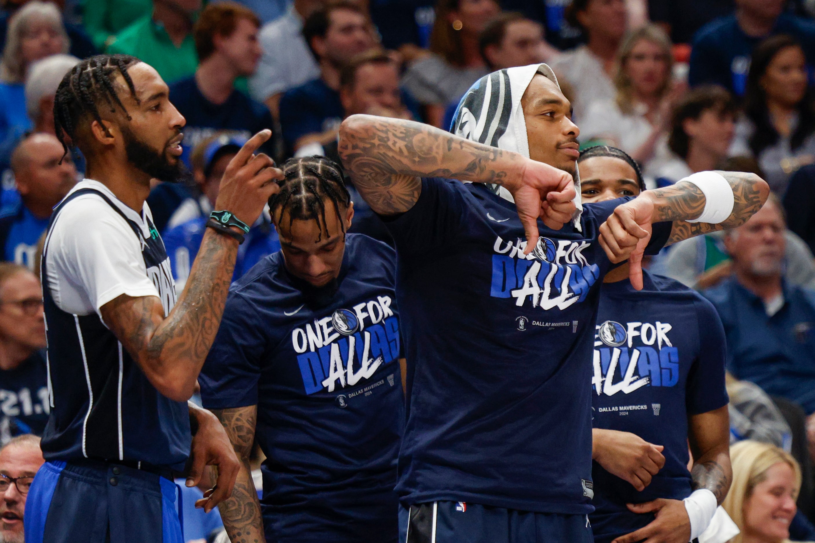 Dallas Mavericks forward P.J. Washington (25) gives a thumbs down after a foul call during...