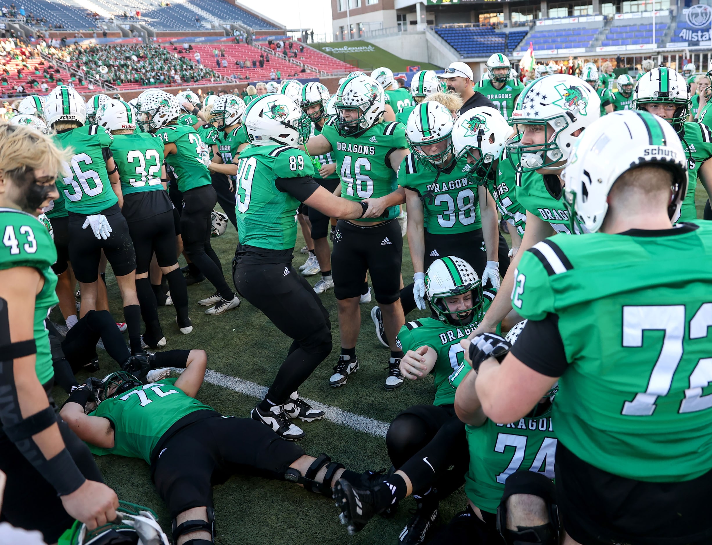 The Southlake Carroll Dragons celebrate a victory over Longview, 20-17 in a Class 6A...