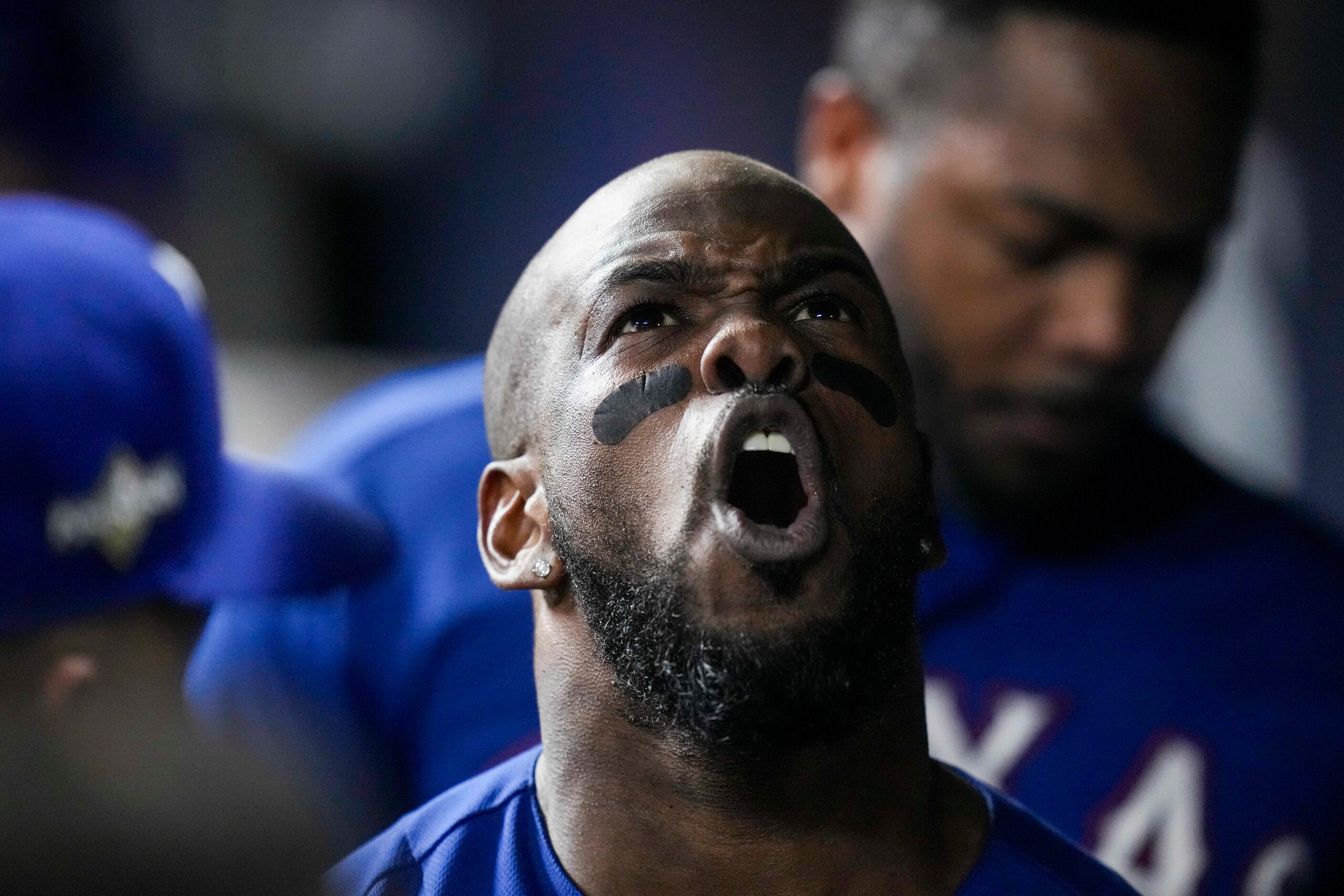 Texas Rangers right fielder Adolis Garcia celebrates after hitting a home run during the...