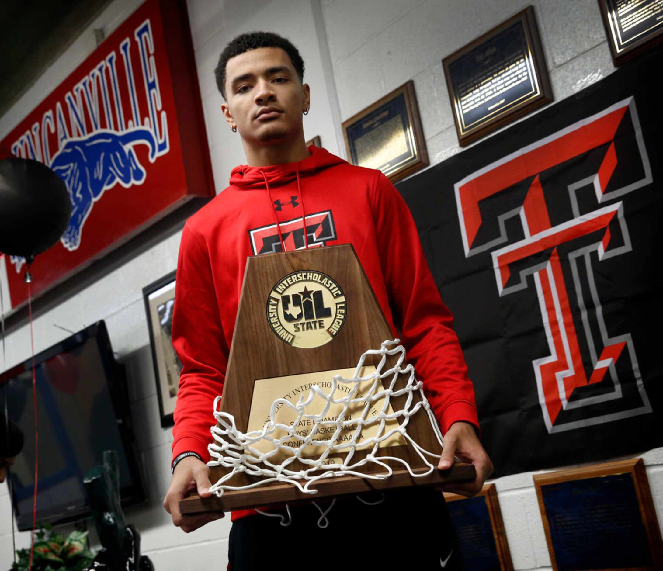 Duncanville boys basketball player Micah Peavy poses with his team's 2019 State Championship...