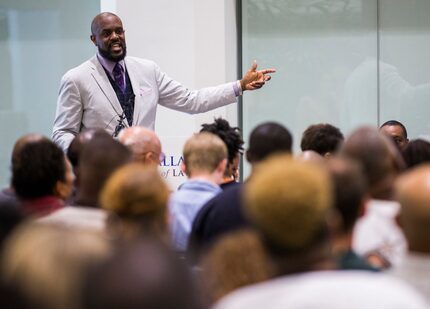 Dr. Michael Waters, pastor at Joy Tabernacle African Methodist Episcopal Church, speaks at a...