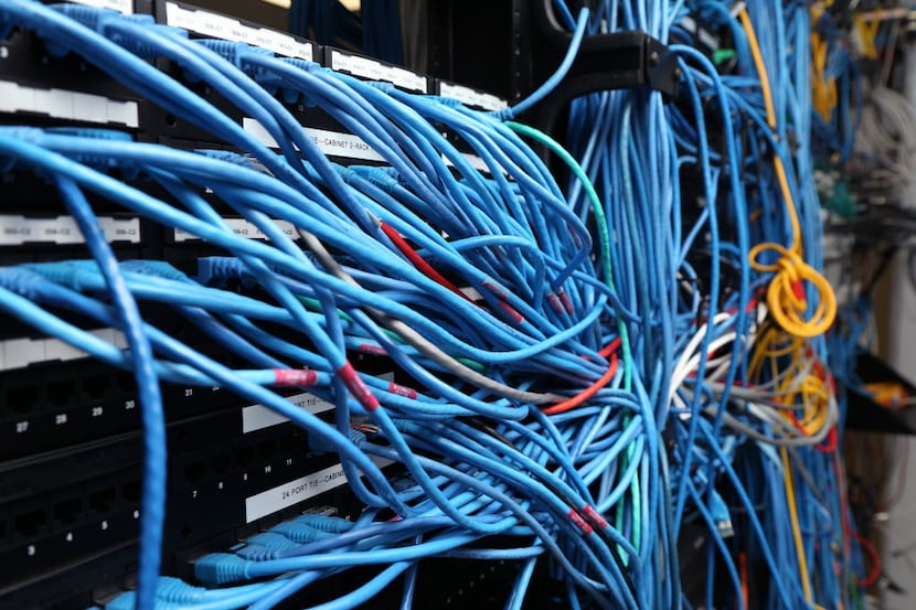 Network cables are plugged in a server room in in New York City. (Photo by Michael...