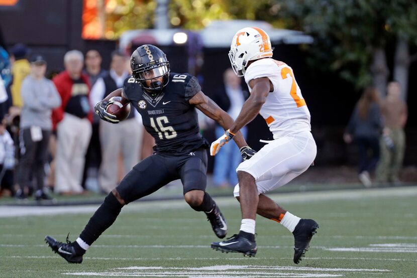 Vanderbilt wide receiver Kalija Lipscomb (16) tries to get past Tennessee defensive back...