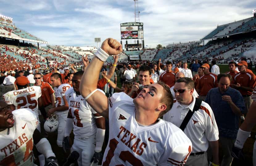 Texas freshman QB Colt McCoy (12) gives thanks for the Longhorns win at the end of the of...