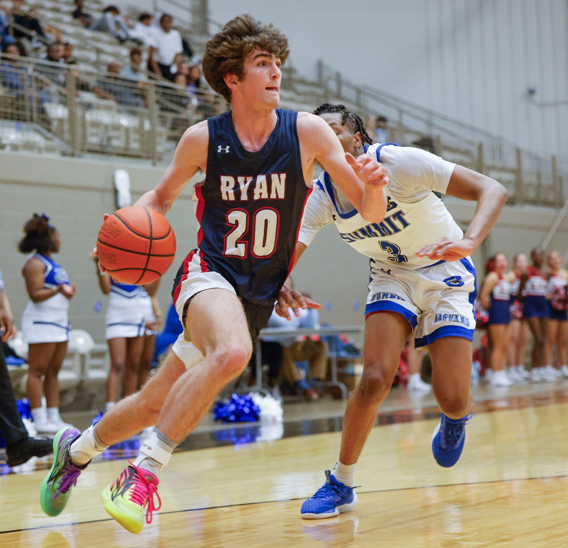 Denton Ryan’s Matthew Carter (2) dribbles past Mansfield Summit’s Quinton Owens-Ross during...