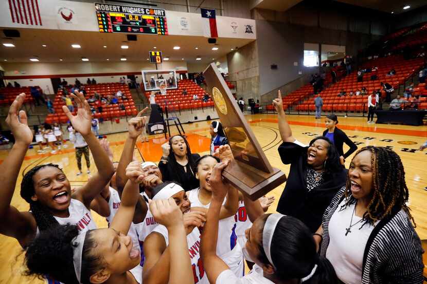 Duncanville's head coach Lajeanna Howard (right) and her players celebrate their Class 6A...