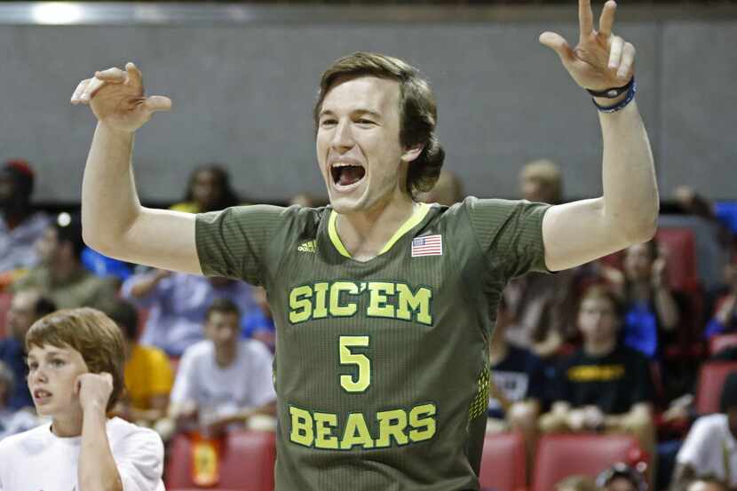 Baylor's Brady Heslip celebrates winning the men's three-point championship during the State...