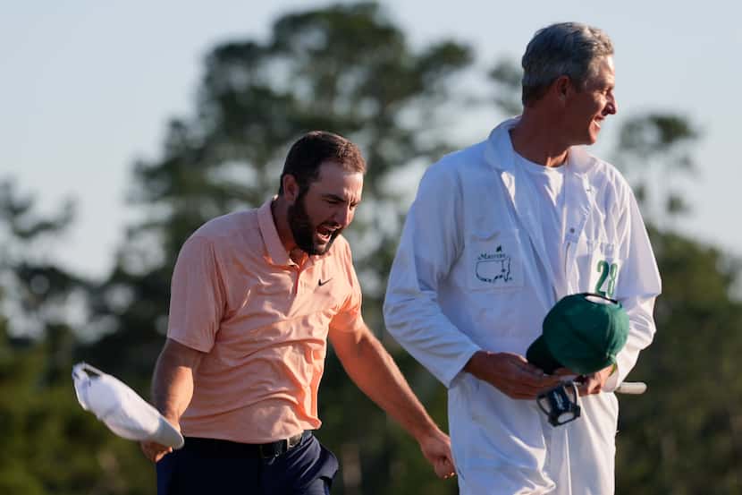 Scottie Scheffler celebrates his win at the Masters golf tournament at Augusta National Golf...