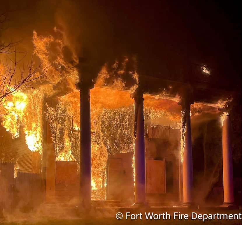 Fort Worth firefighters contain a blaze Tuesday at a historic home in the 2100 block of...