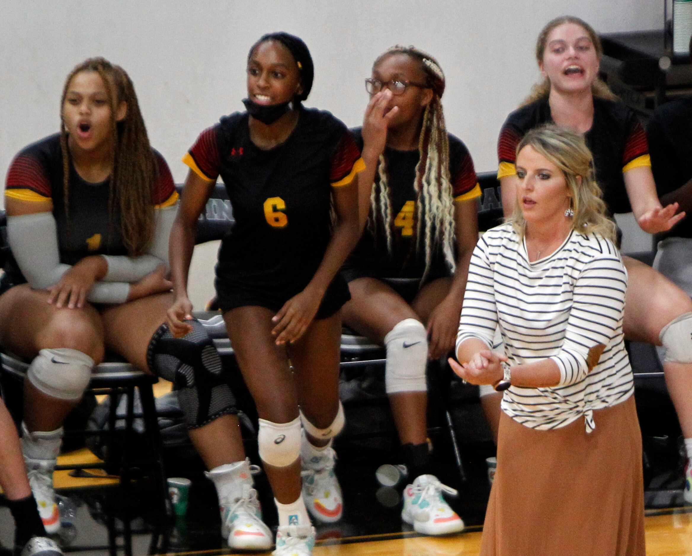 South Grand Prairie head coach Lindsay Fallen reacts with players to a scored point during...