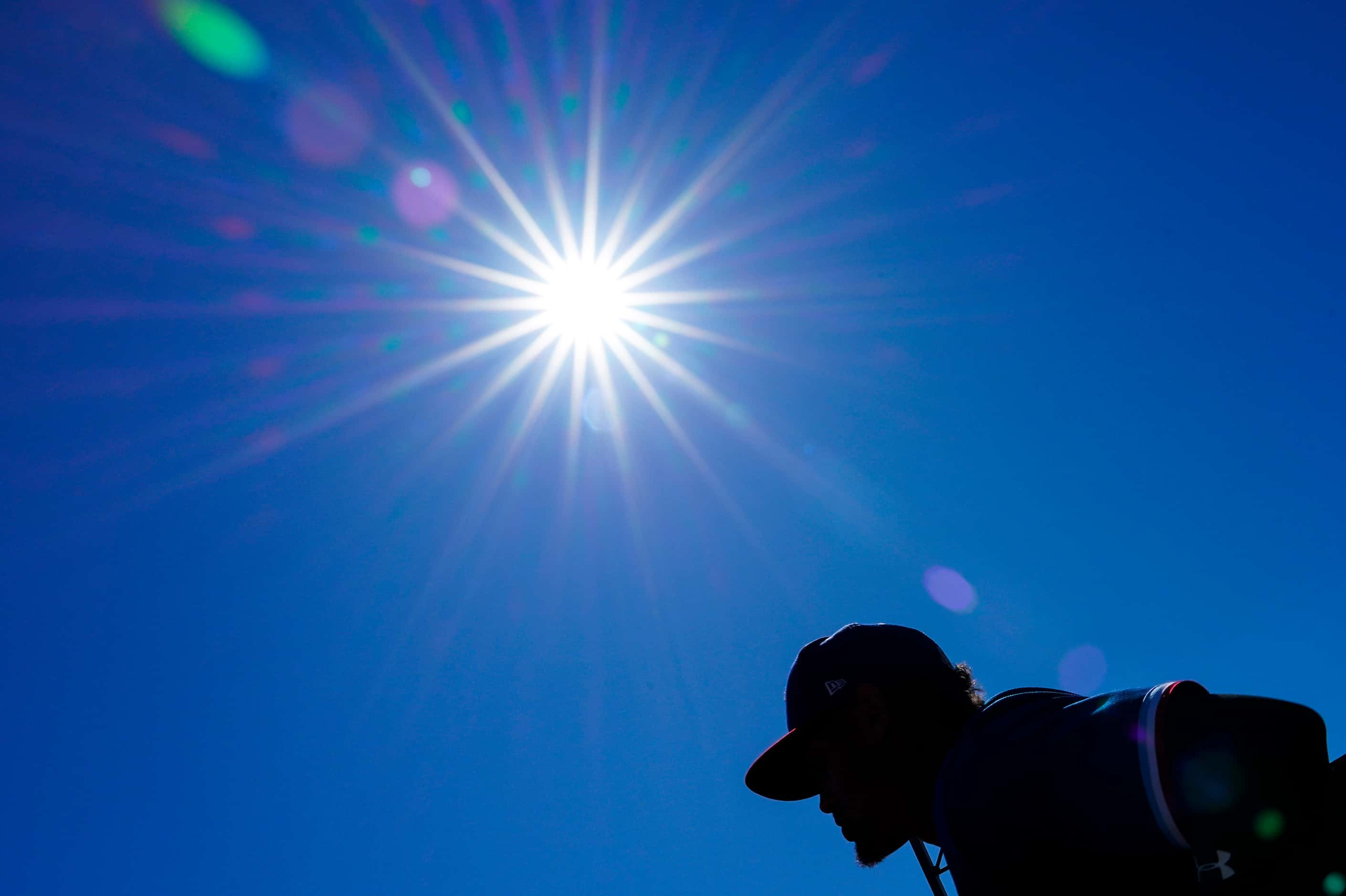 Texas Rangers first baseman Ronald Guzman takes the field before a spring training game...