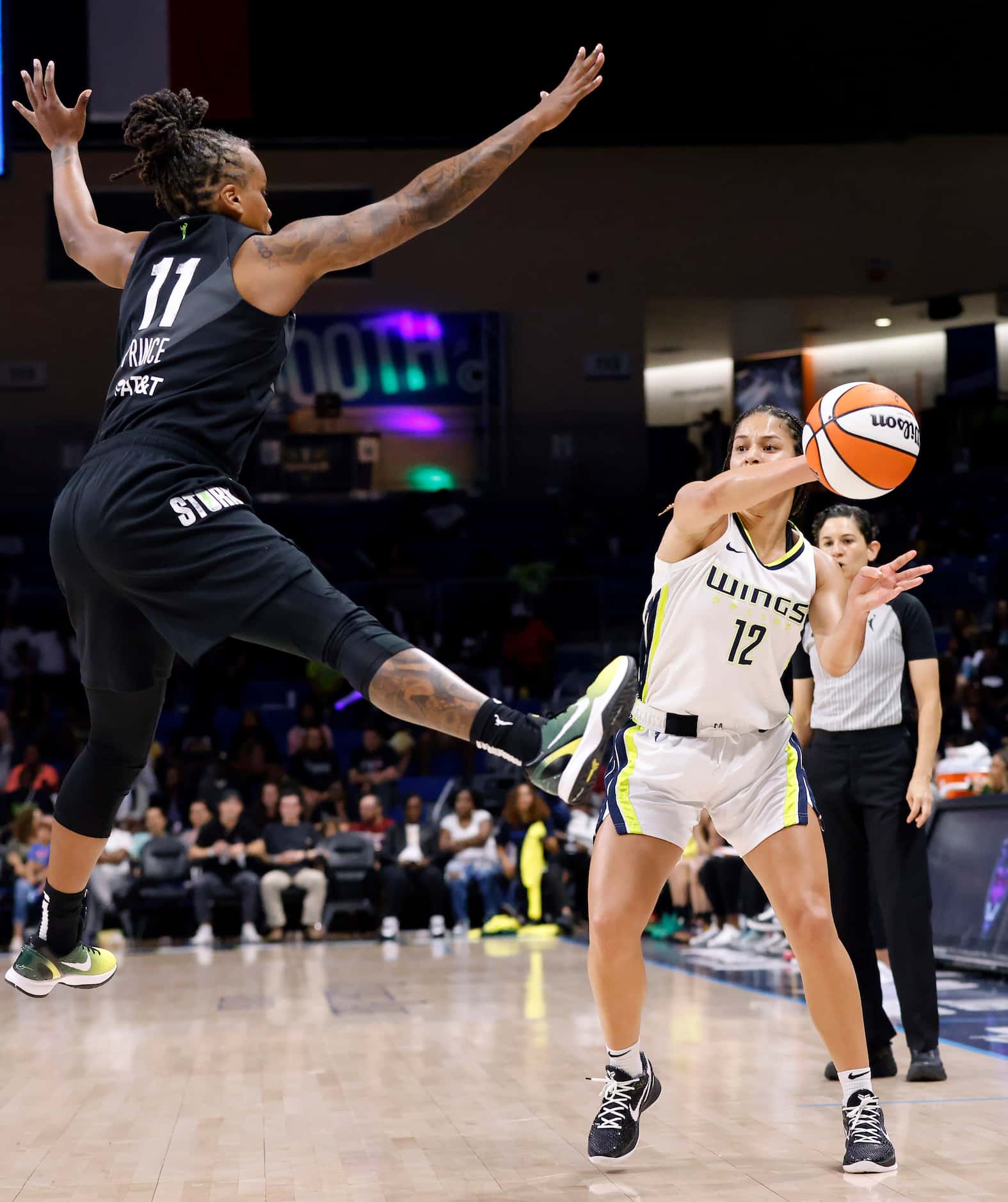 Seattle Storm guard Epiphanny Prince (11) leaps to block as pass by Dallas Wings guard...