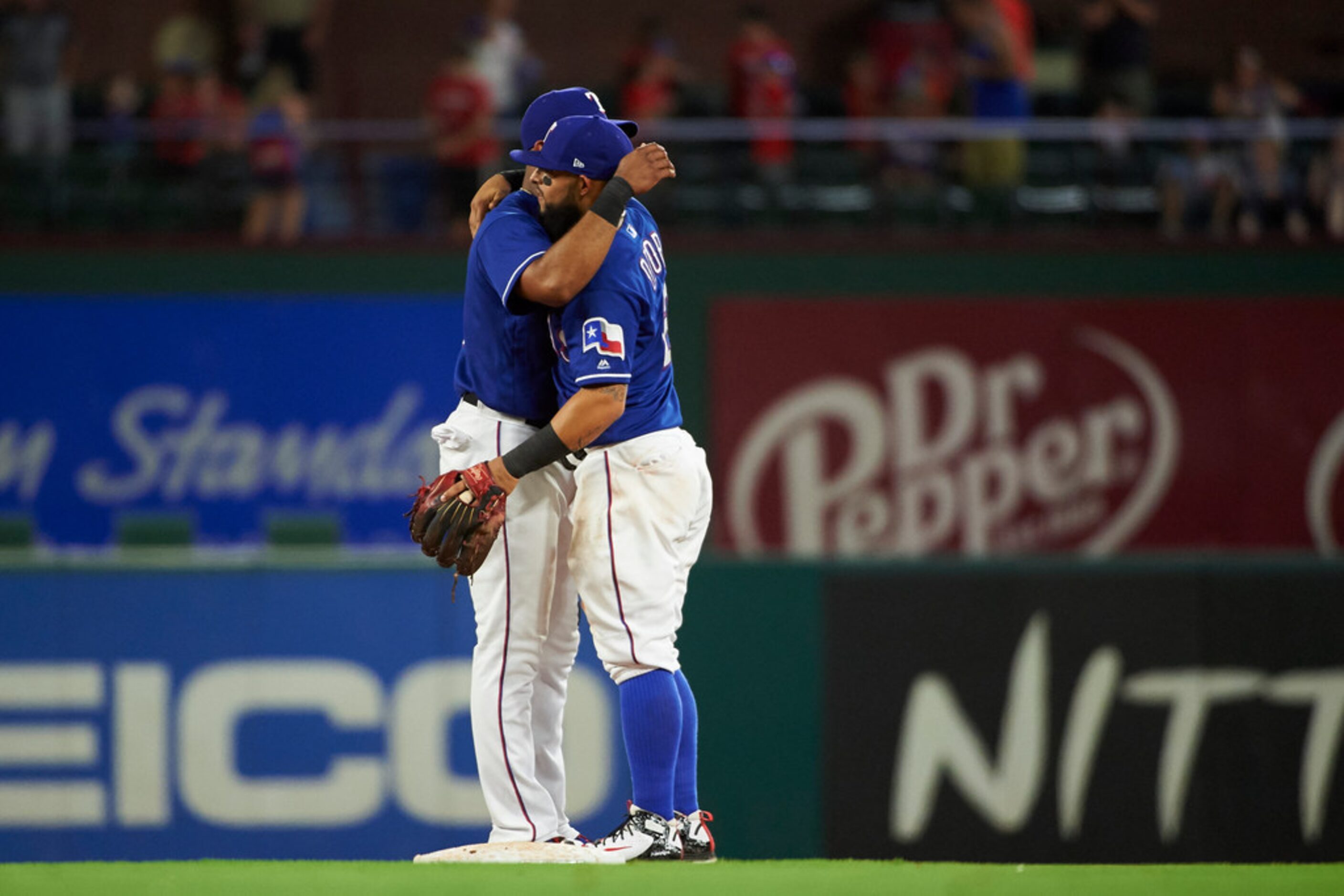 Texas Rangers' Elvis Andrus, left, and Rougned Odor celebrate after the Rangers defeated the...