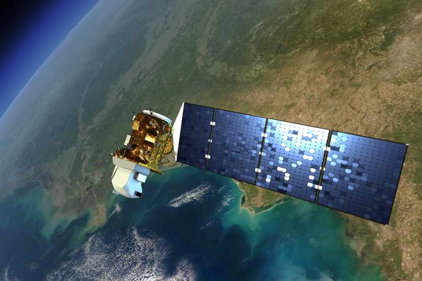This artist rendering released by NASA shows the Landsat satellite in orbit around Earth....