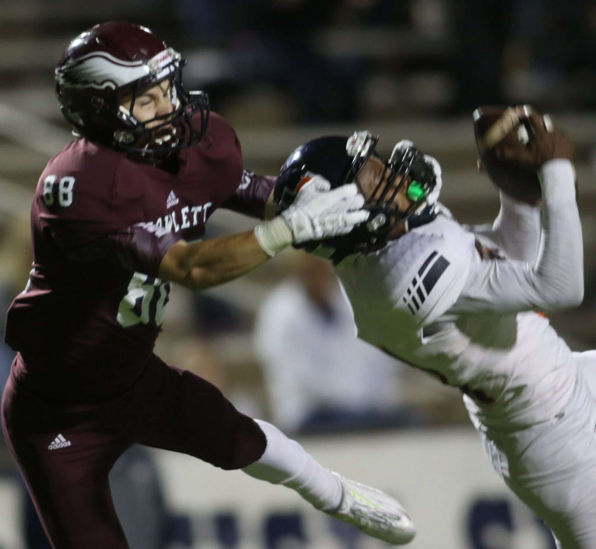 Sachse defensive back Devo'nte Emory (31) comes down with an interception as Rowlett...