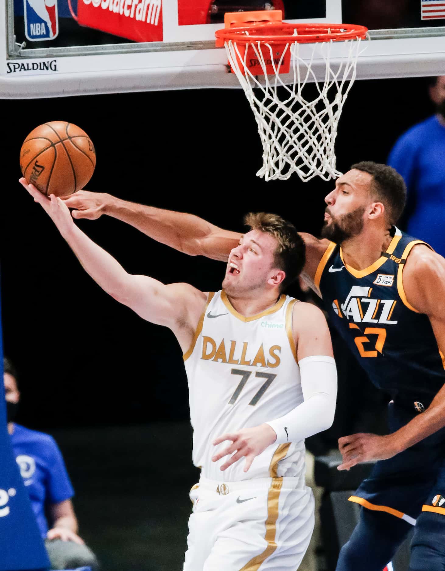 Dallas Mavericks guard Luka Doncic (77) attempts a layup as Utah Jazz forward Rudy Gobert...