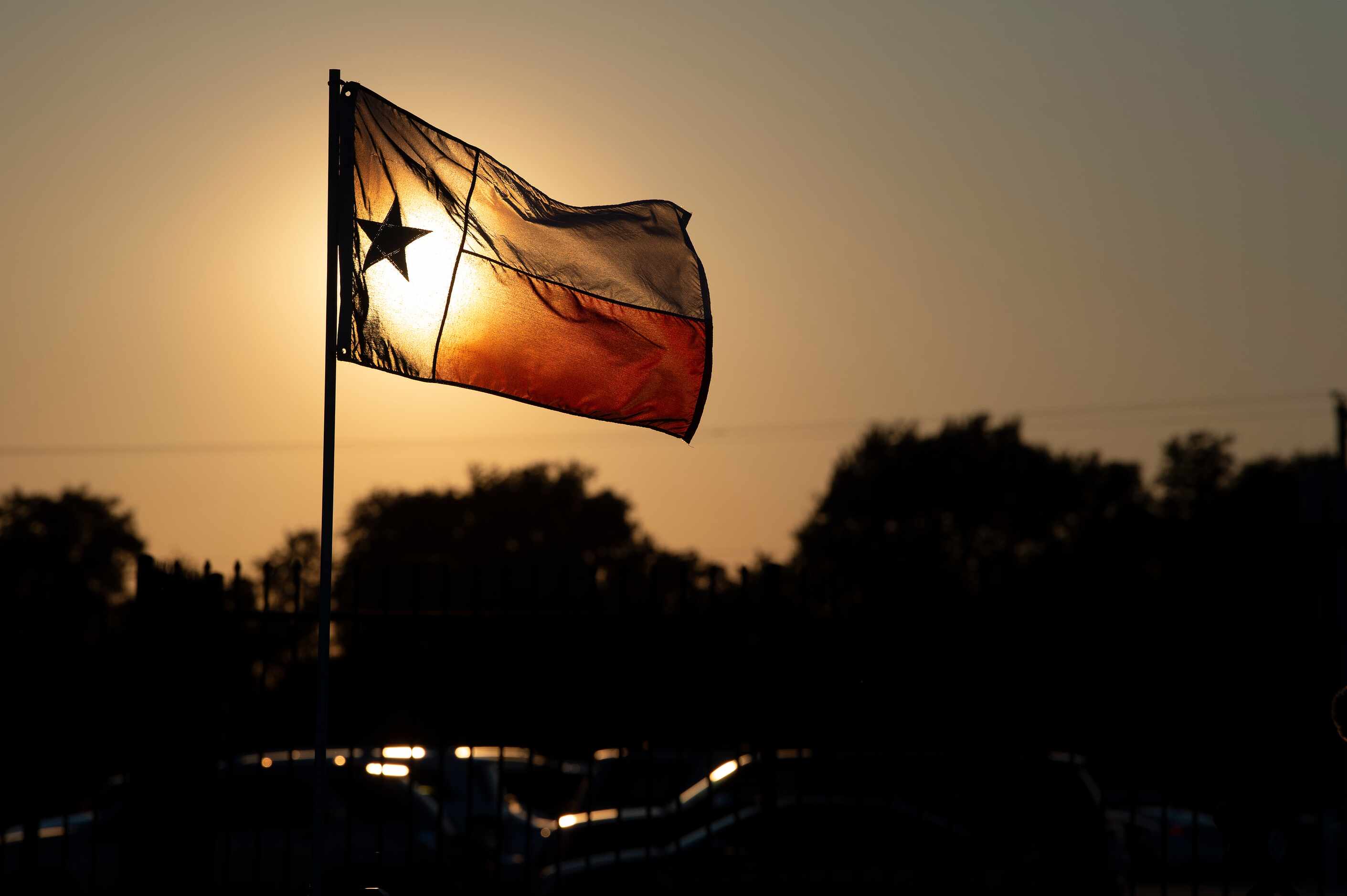 A Texas flag flies over Billy Goodloe Stadium before a high school football game between Red...