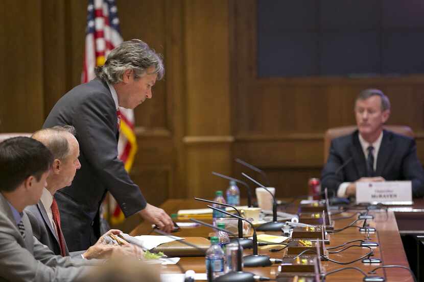 University of Texas Regent Wallace Hall (left, standing) sued UT System Chancellor Bill...