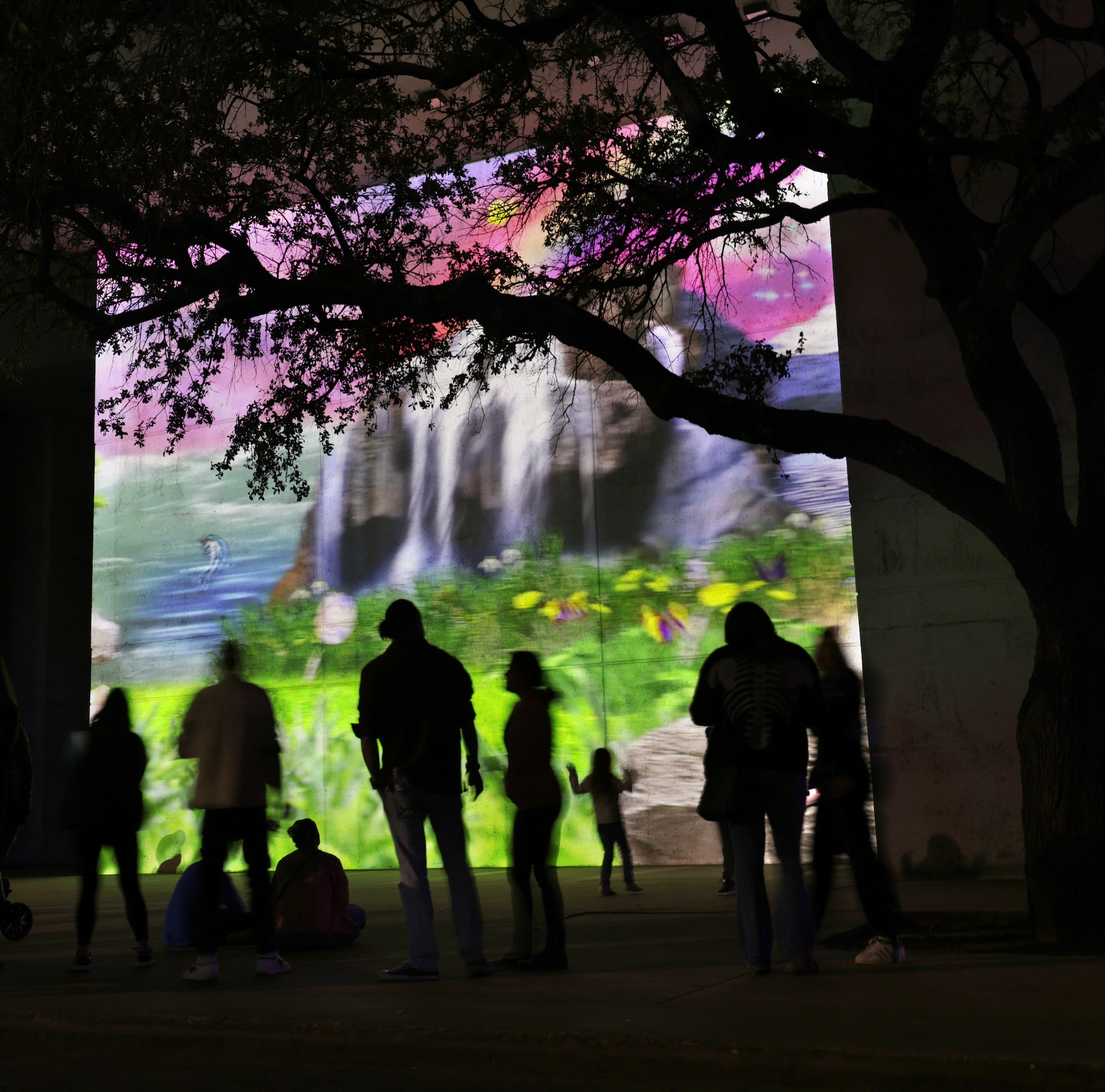 Community members interact with art installations during Aurora in downtown Dallas, TX, on...