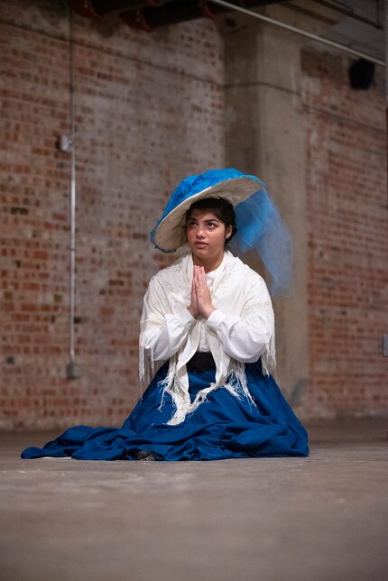 Maya Reddy as Geraldine Packard prays during a scene from Cry Havoc Theater Company's...