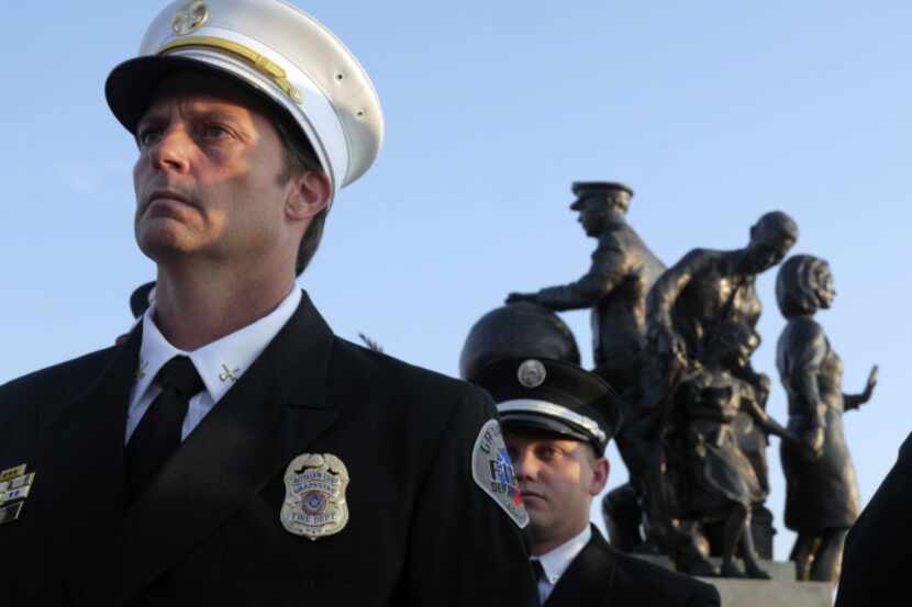 Grapevine Fire Department Honor Guard member Richie Tice stands at attention during a past...