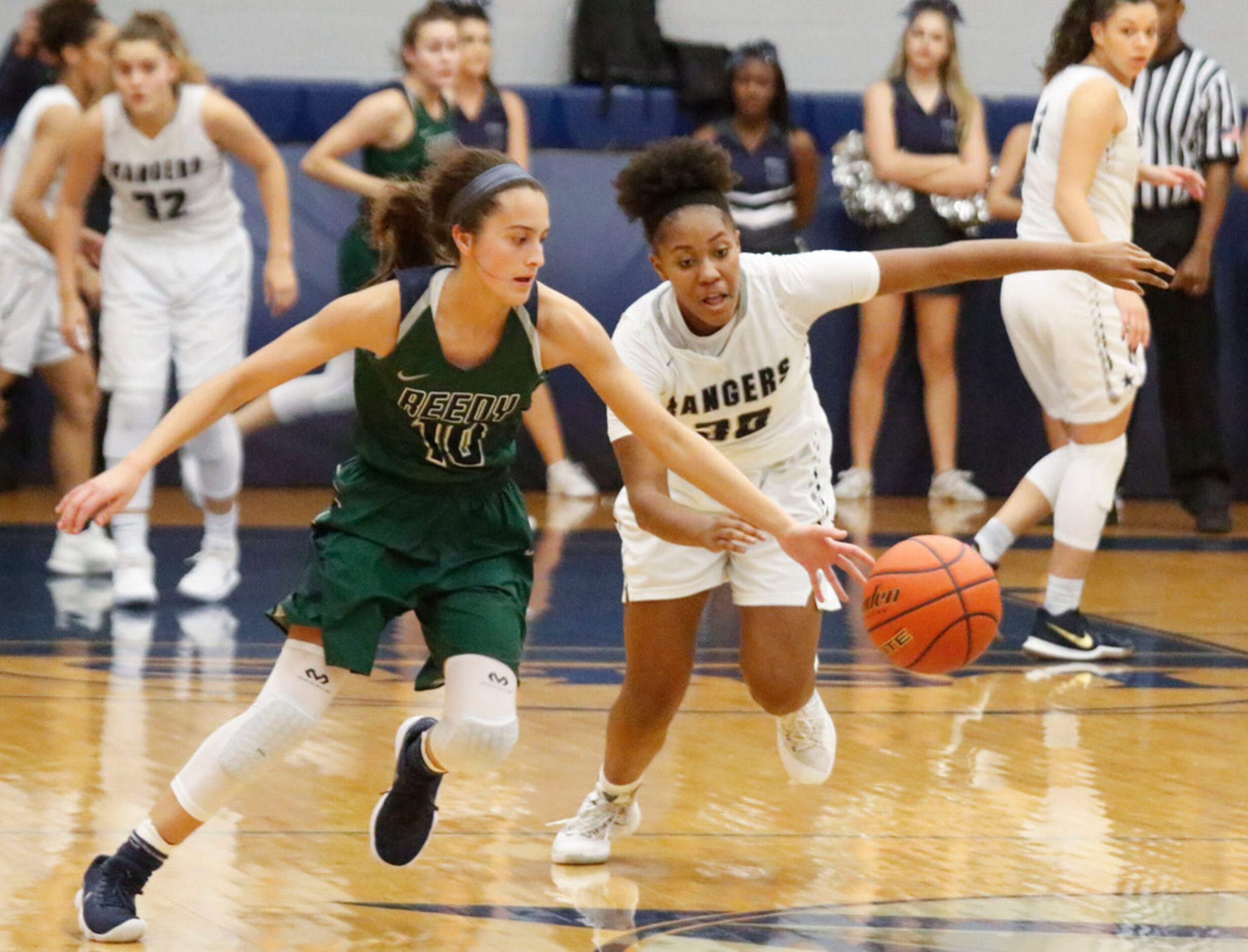 Frisco Reedy's Sophia Thomas (10) and Frisco Lone Kayla Richardson (30) scramble for the...