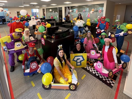 Employees of Hilltop Holdings dressed in Mario Kart costumes for Halloween