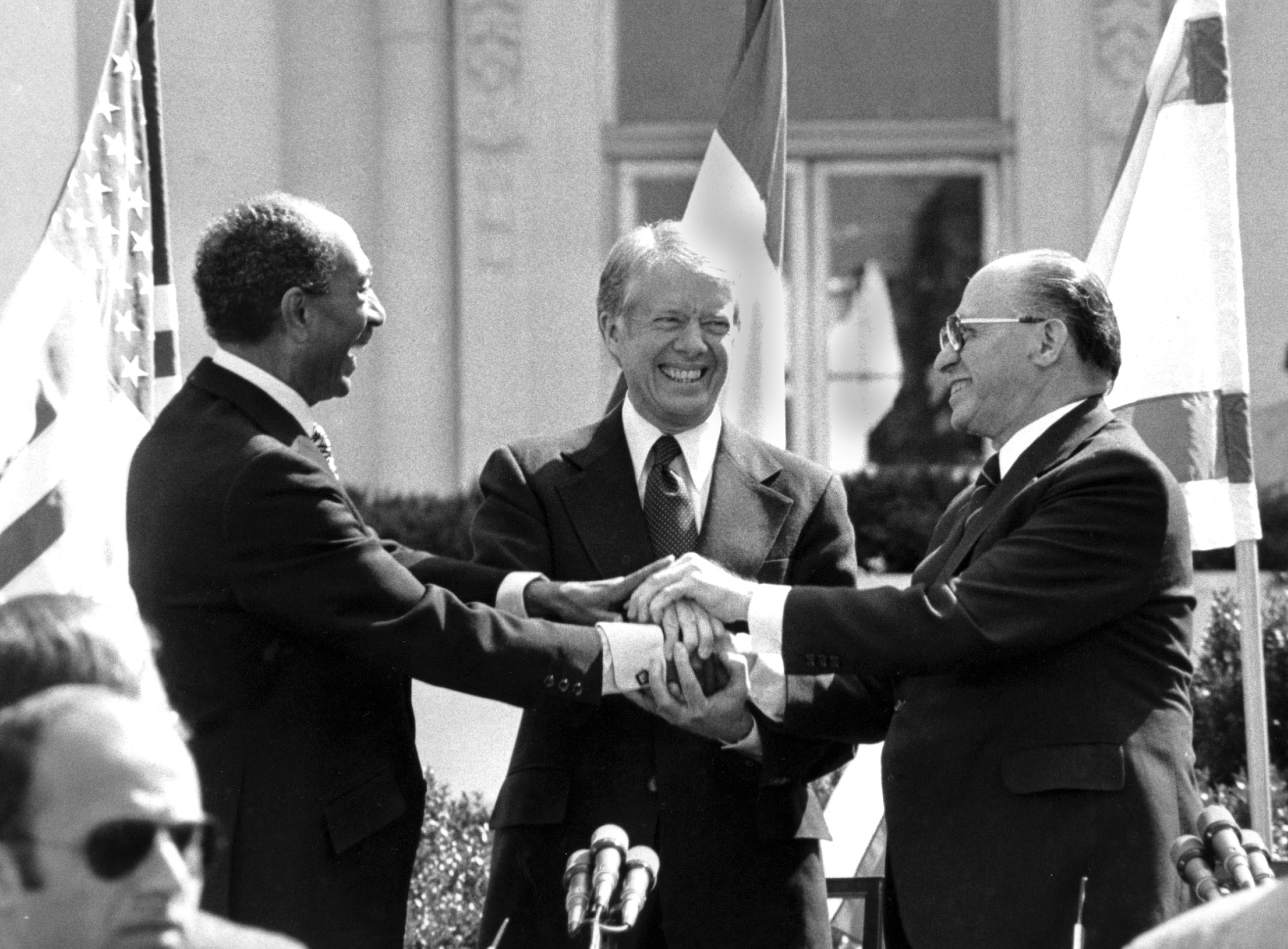 Egyptian President Anwar Sadat, left, U.S. President Jimmy Carter, center, and Israeli Prime...