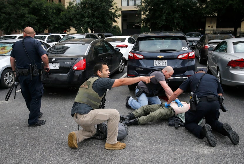 Members of the Department of Homeland Security and the U.S. Marshals Service gave first aid...