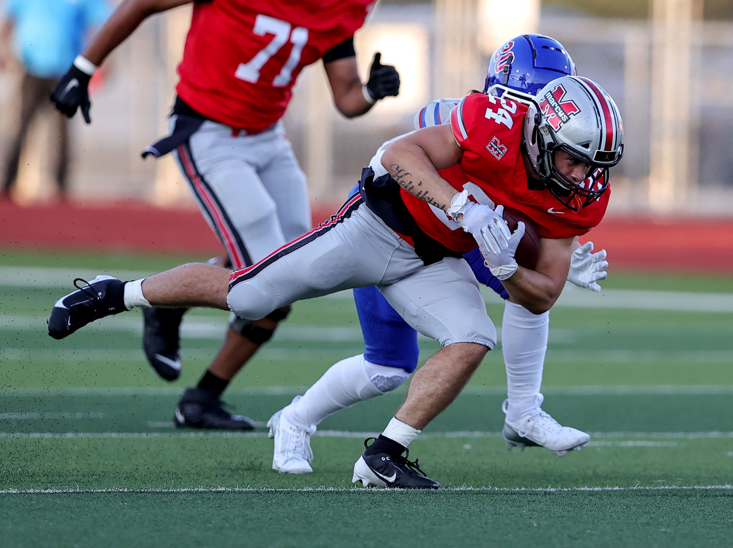 Flower Mound Marcus running back Isaiah Keliikipi (24) with a nice run against Richardson...