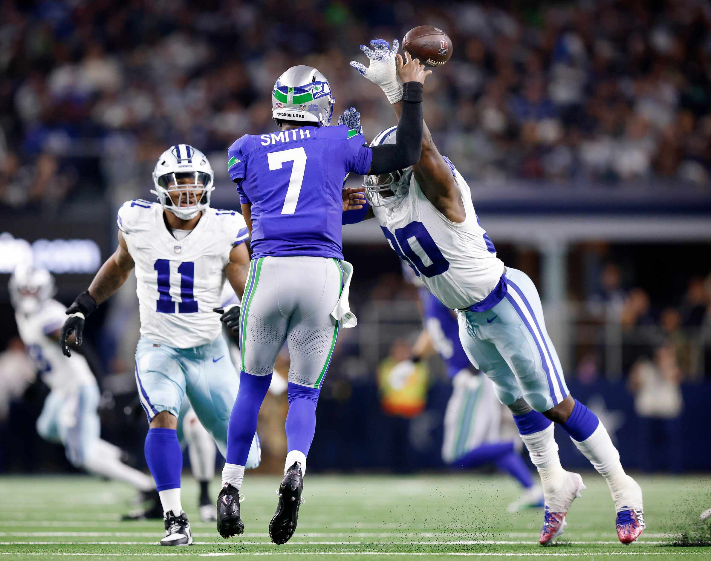 Dallas Cowboys defensive end DeMarcus Lawrence (90) blocks a pass by Seattle Seahawks...
