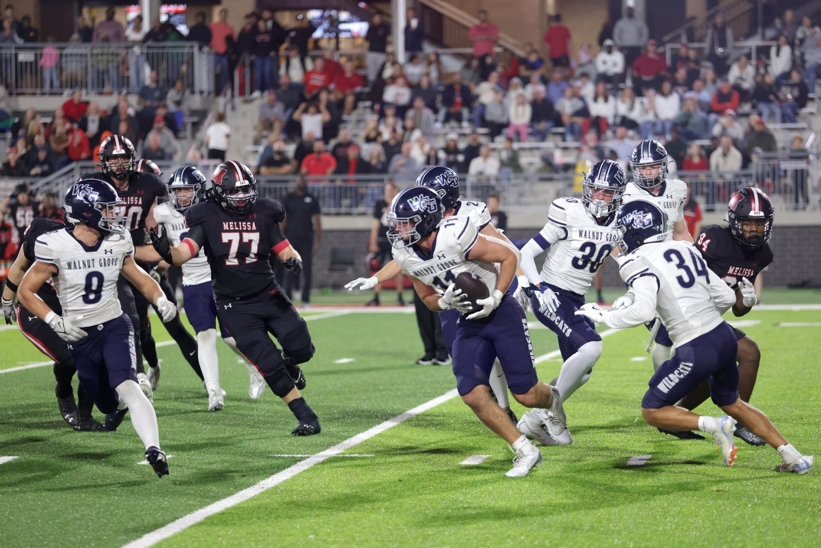 Walnut Grove player #11 Keller Pittenger recovers the ball after a blocked kick during the...