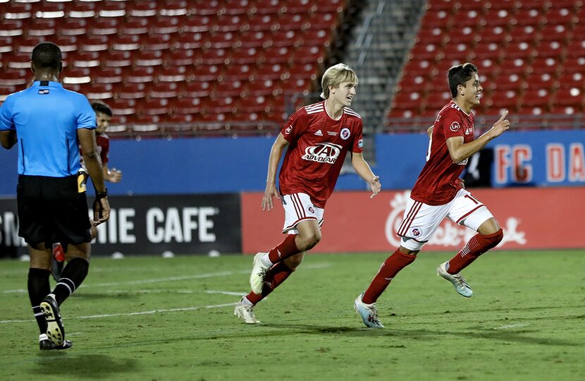 Arturo Rodriguez celebrates his goal while Thomas Roberts chases him in the USL League One...