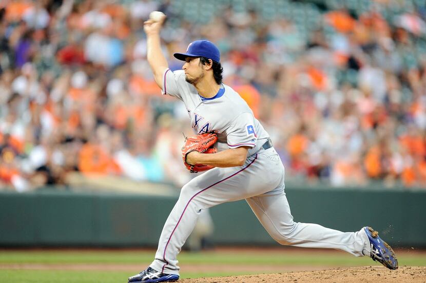 BALTIMORE, MD - AUGUST 02:  Yu Darvish #11 of the Texas Rangers pitches in the third inning...